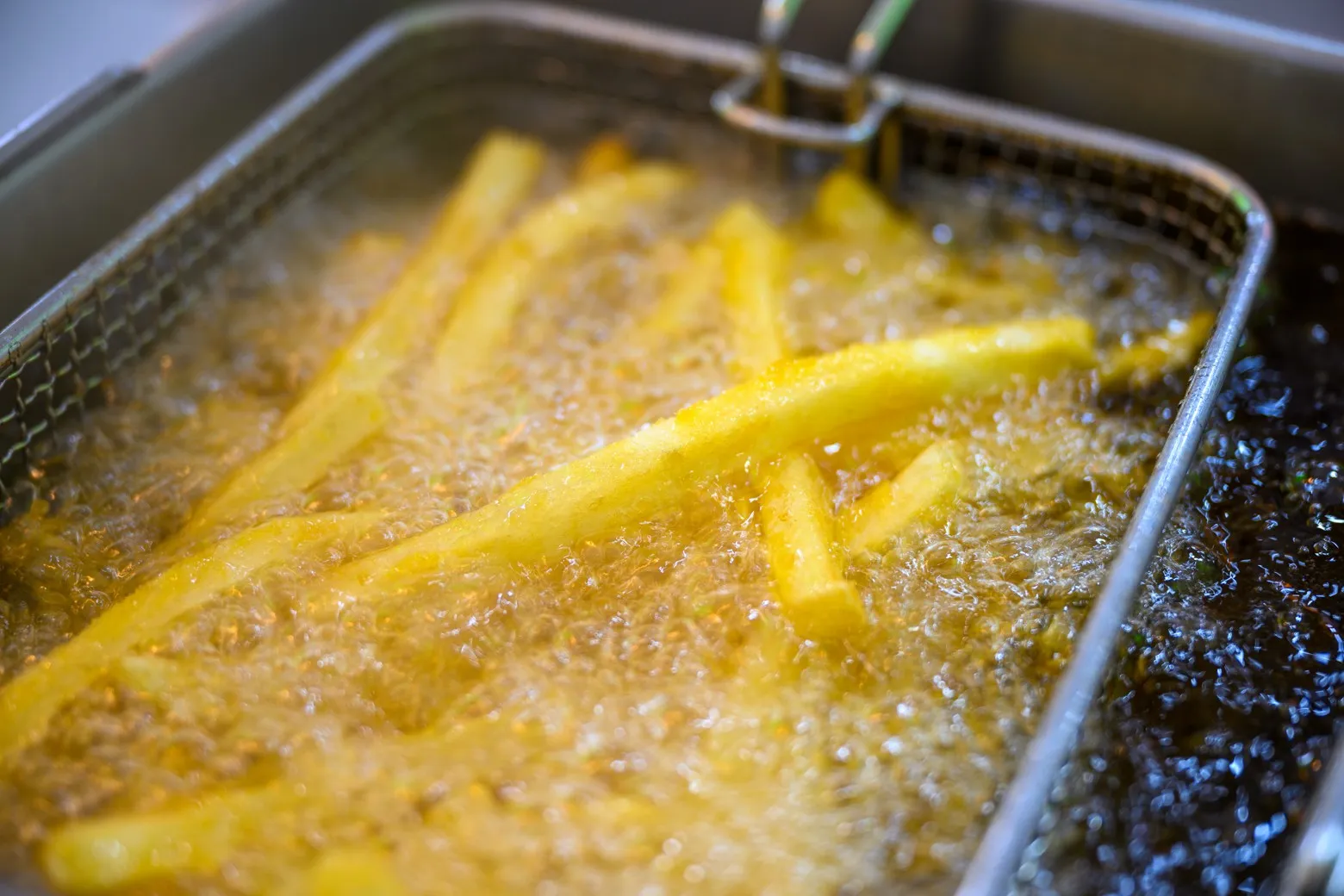 French fries in a deep fry basket